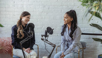 Two women podcasting